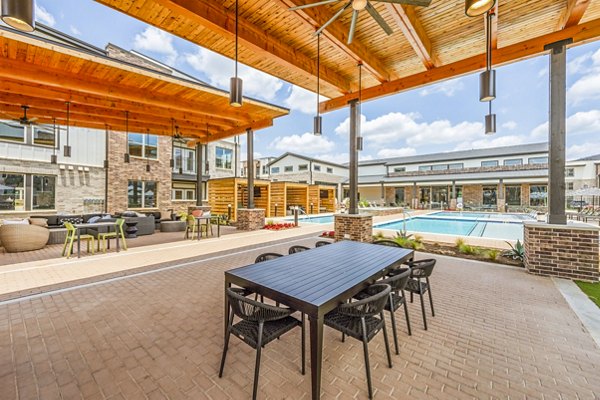 Rooftop pool and scenic patio at Lenox Grand West Apartments offering luxury outdoor relaxation