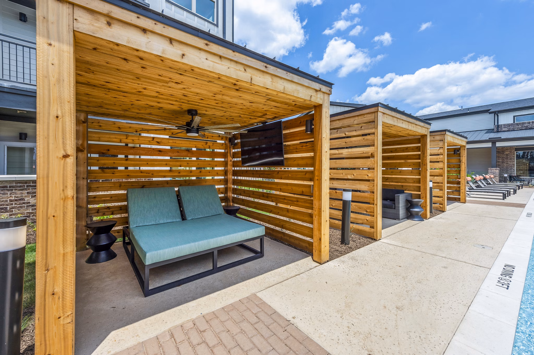 Luxurious pool cabanas at Lenox Grand West Apartments, perfect for relaxation and leisure in a premier residential setting