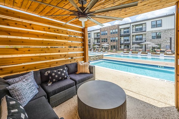 Luxury poolside cabana at Lenox Grand West Apartments with comfortable seating and scenic views