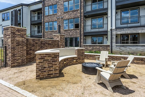 Cozy fire pit area at Lenox Grand West Apartments, providing a warm outdoor gathering space