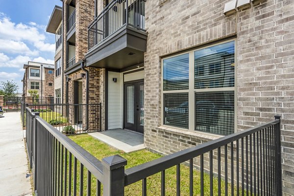 Patio area with cozy seating at Lenox Grand West Apartments, ideal for relaxation in a luxury setting