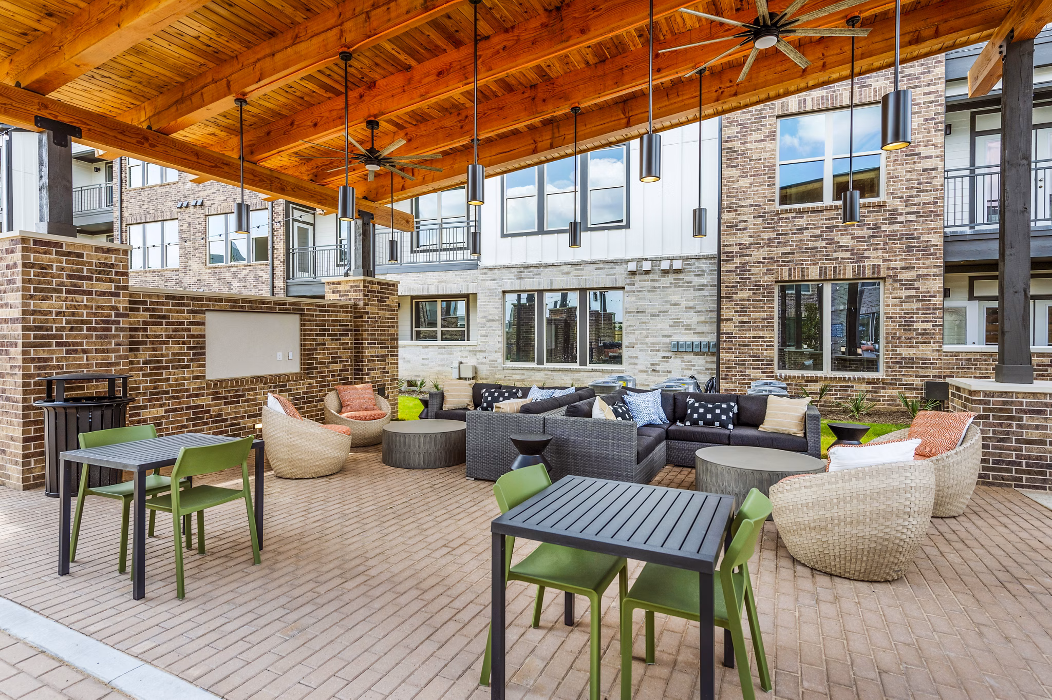 Resort-style pool and sunlit patio at Lenox Grand West Apartments, offering luxury living and relaxation spaces