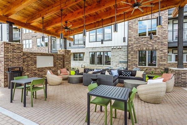 Resort-style pool and sunlit patio at Lenox Grand West Apartments, offering luxury living and relaxation spaces