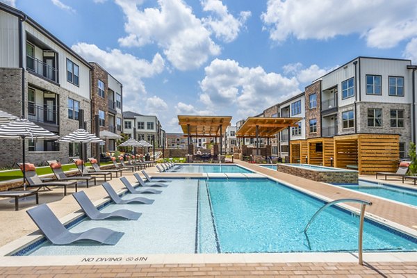 Luxurious pool area with loungers and greenery at Lenox Grand West Apartments, ideal for relaxing or socializing