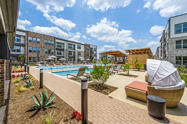 Poolside cabana with lounge seating at Lenox Grand West Apartments