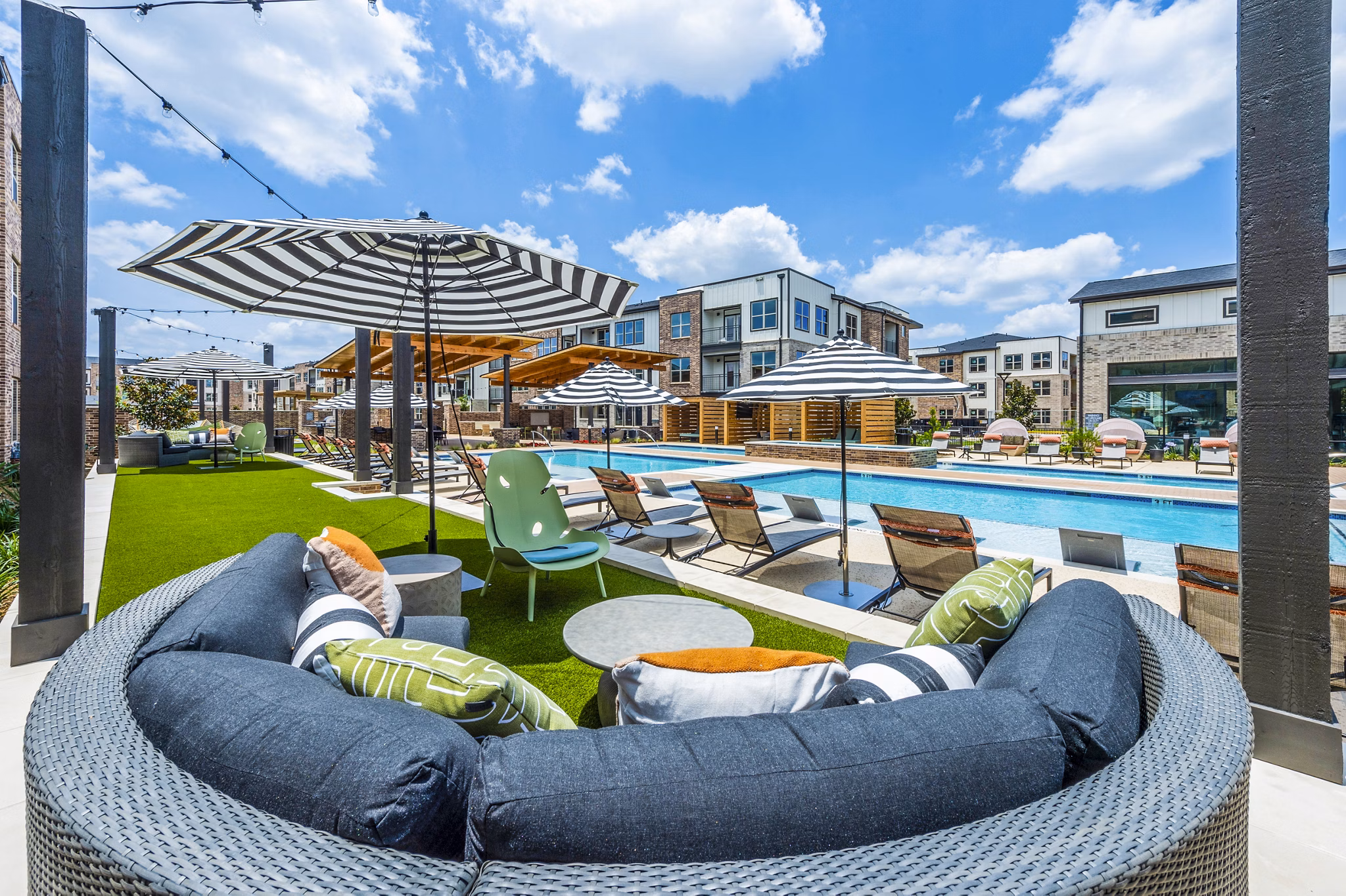 Luxurious poolside cabana at Lenox Grand West Apartments: Modern retreat with comfortable seating and a serene ambiance for relaxation