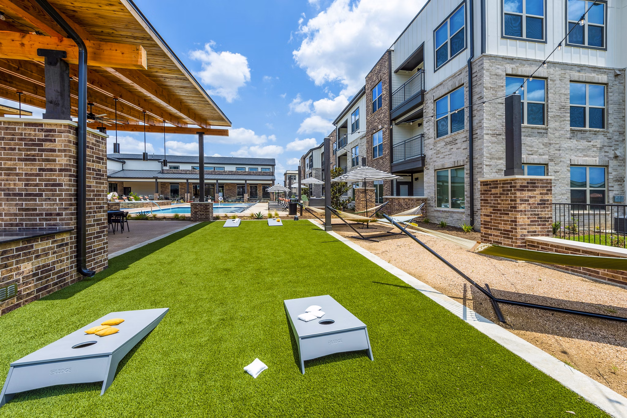 Expansive recreational area with fitness equipment at Lenox Grand West Apartments, a luxury living community offering premium amenities