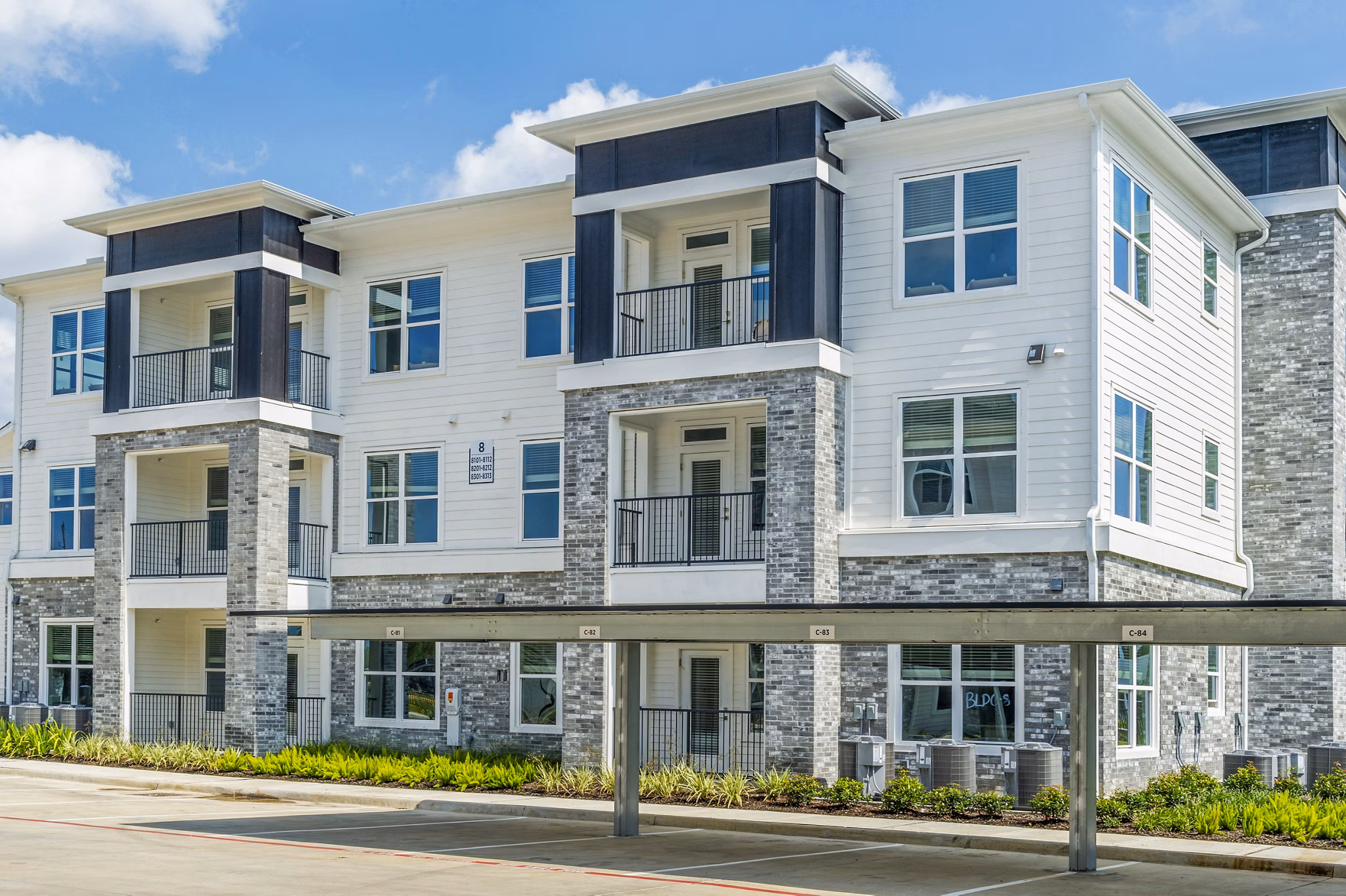 The Madison Apartments: Building with covered parking in a luxury community