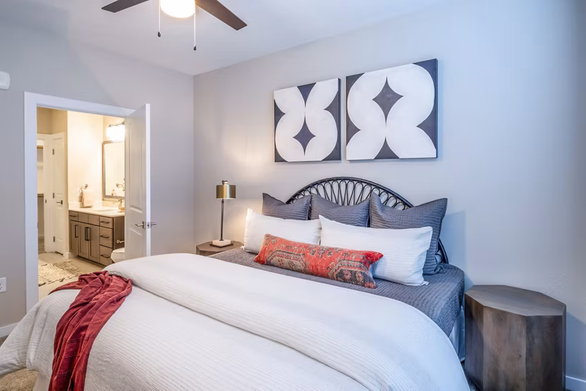 Contemporary bedroom with elegant decor at The Madison Apartments