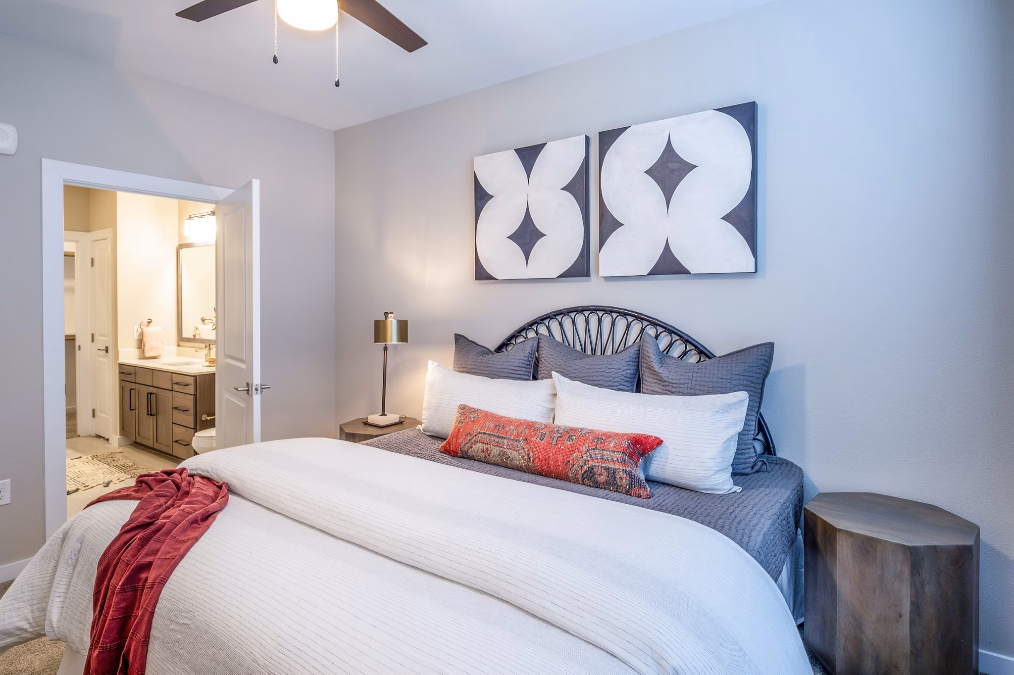 Contemporary bedroom with elegant decor at The Madison Apartments