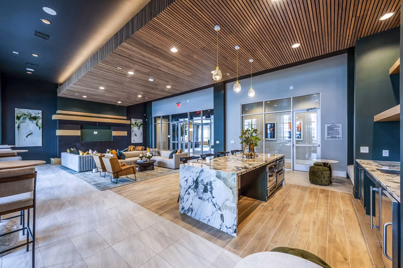 Elegant clubhouse lobby with modern furnishings at The Madison Apartments