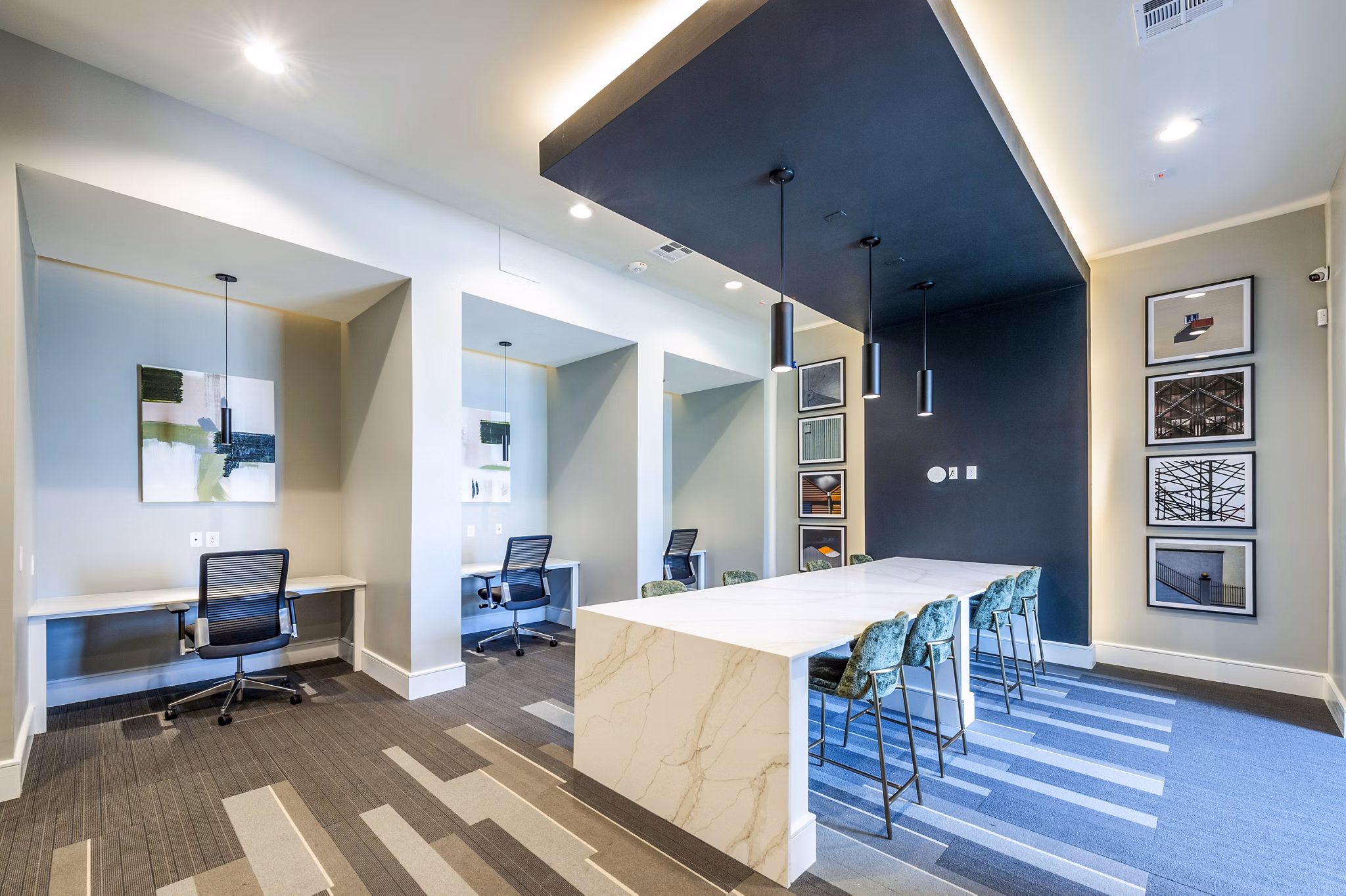 Modern business center with collaborative workspaces at The Madison Apartments clubhouse