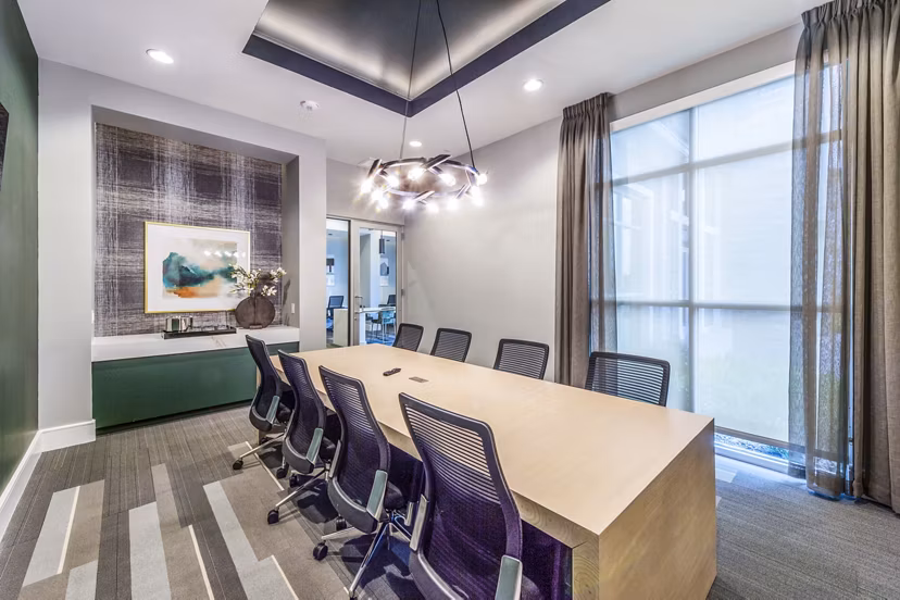 Clubhouse meeting facility with modern seating at The Madison Apartments, a luxury community offering gatherings and events space