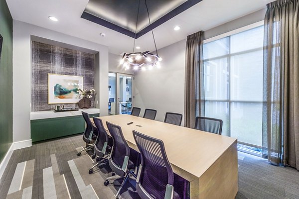 Clubhouse meeting facility with modern seating at The Madison Apartments, a luxury community offering gatherings and events space
