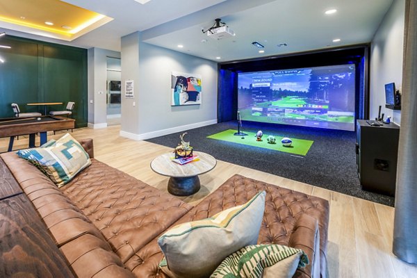 clubhouse game room/virtual putting green at The Madison Apartments