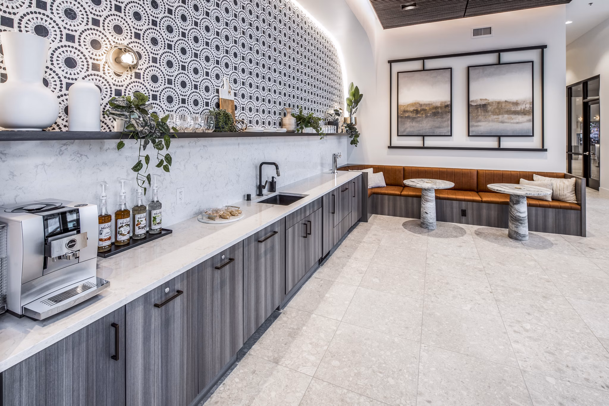 Clubhouse featuring modern design and cozy seating areas at Broadstone Claro Apartments