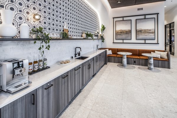Clubhouse featuring modern design and cozy seating areas at Broadstone Claro Apartments
