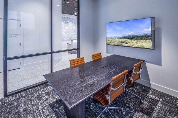 Contemporary clubhouse meeting facility with modern seating at Broadstone Claro Apartments