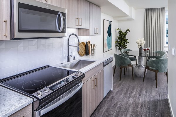 Modern kitchen with stylish cabinetry and stainless steel appliances in Broadstone Claro Apartments luxury residences