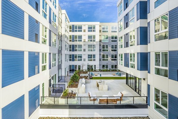 Patio with modern BBQ grill area at Broadstone Claro Apartments, offering luxury outdoor living spaces and social gathering spots