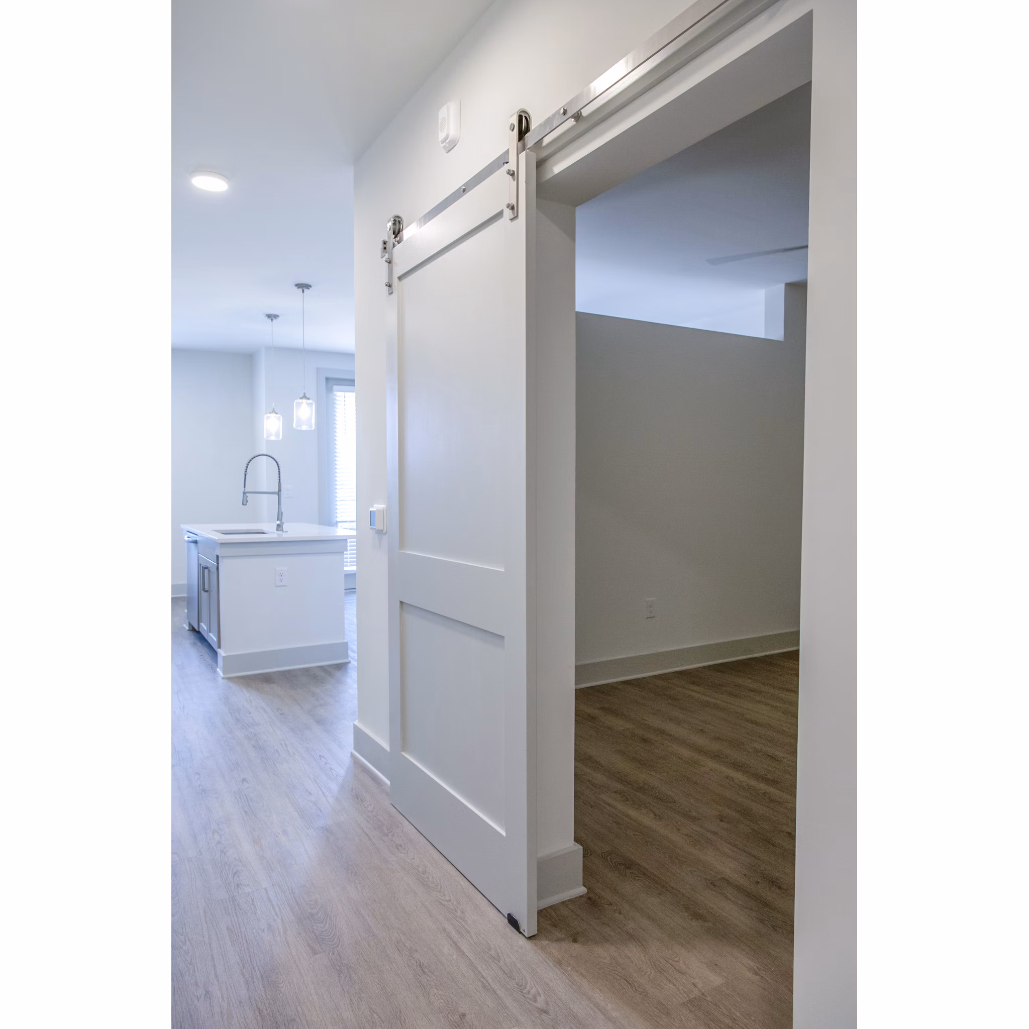 Luxurious bedroom with modern decor at Lakehouse on Wylie Apartments, featuring serene lake views and spacious design