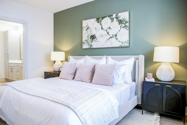 Cozy bedroom with modern decor at Lakehouse on Wylie Apartments, offering luxury living near Lake Wylie
