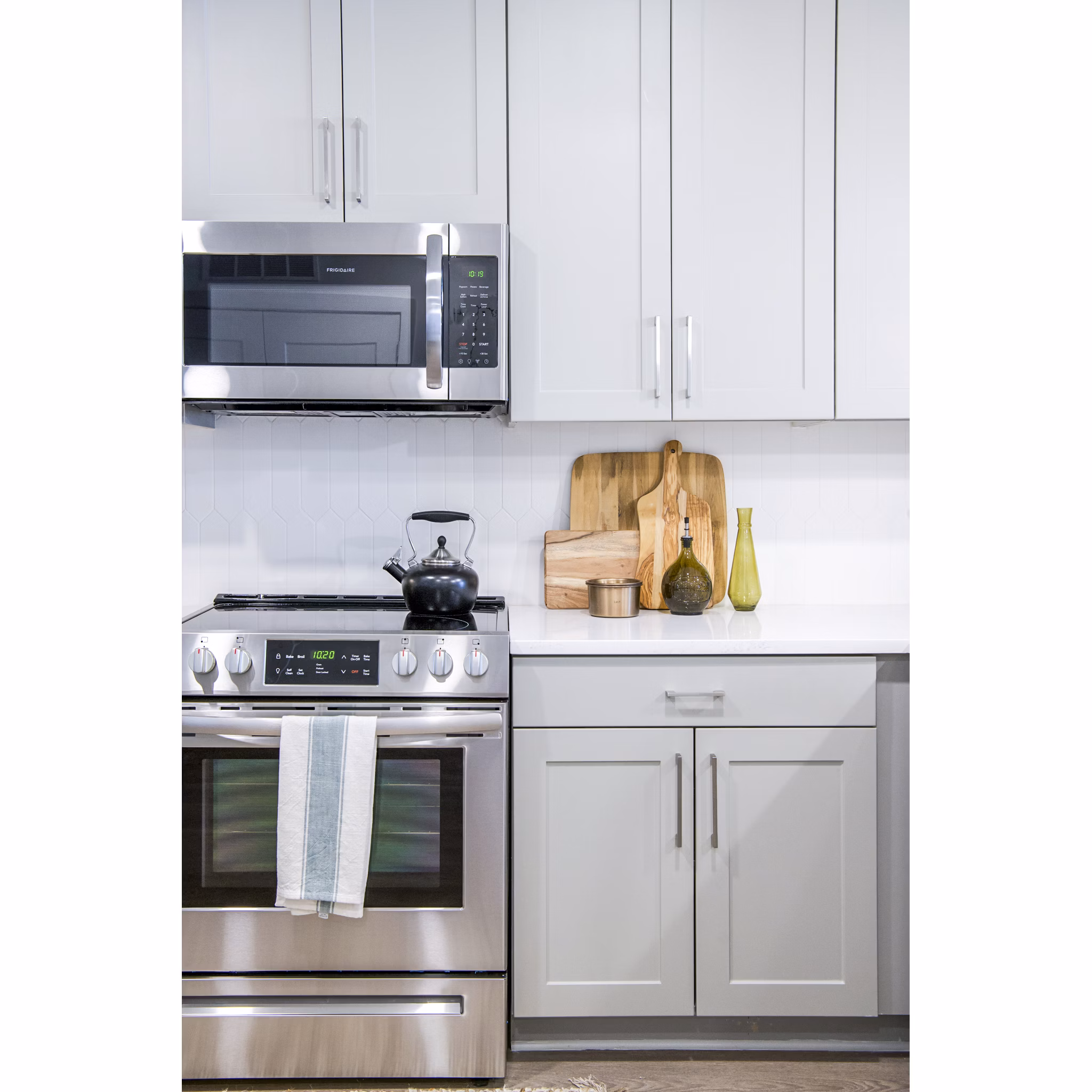 Modern kitchen with stainless steel appliances at Lakehouse on Wylie Apartments offering luxury living