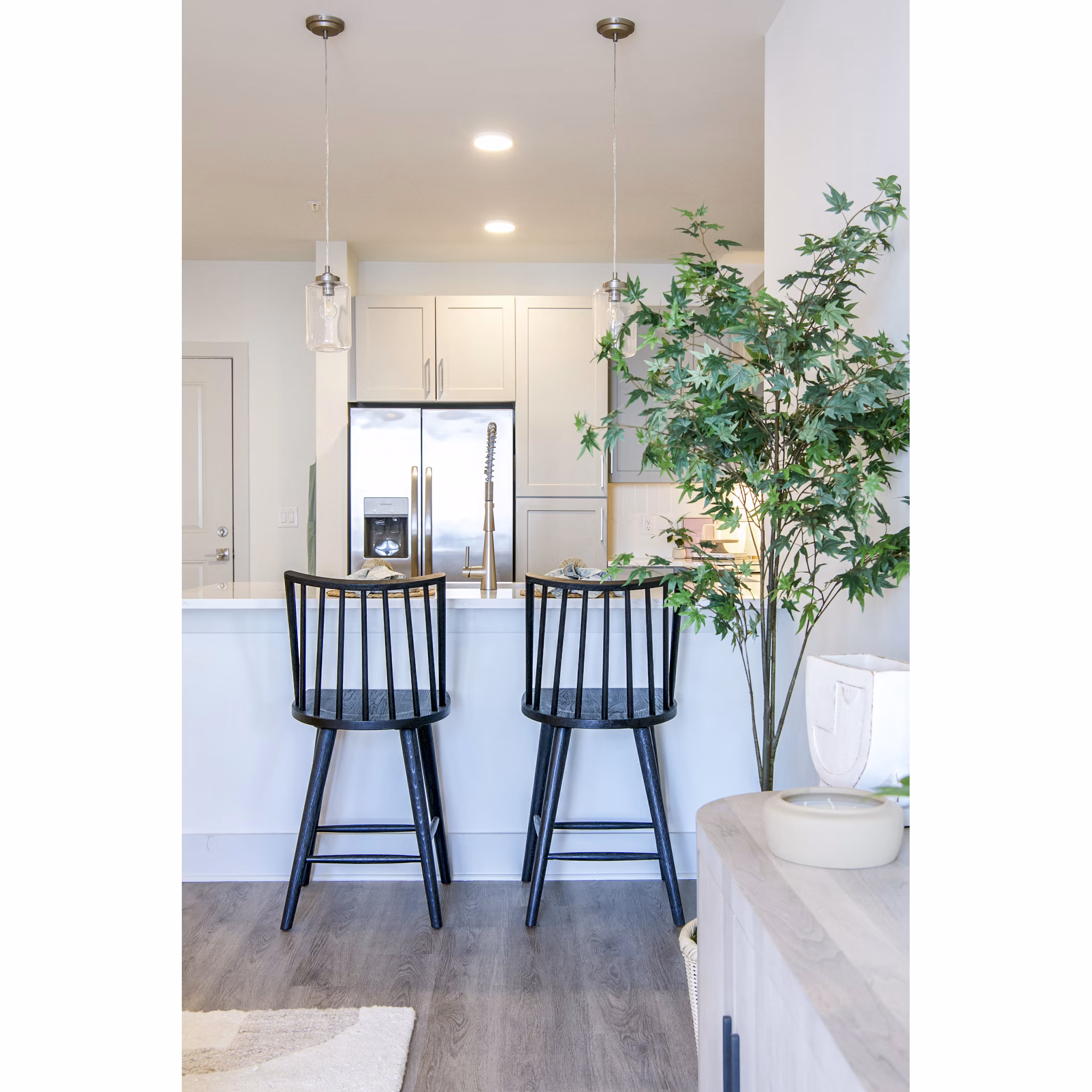 Modern kitchen with stainless steel appliances in Lakehouse on Wylie Apartments