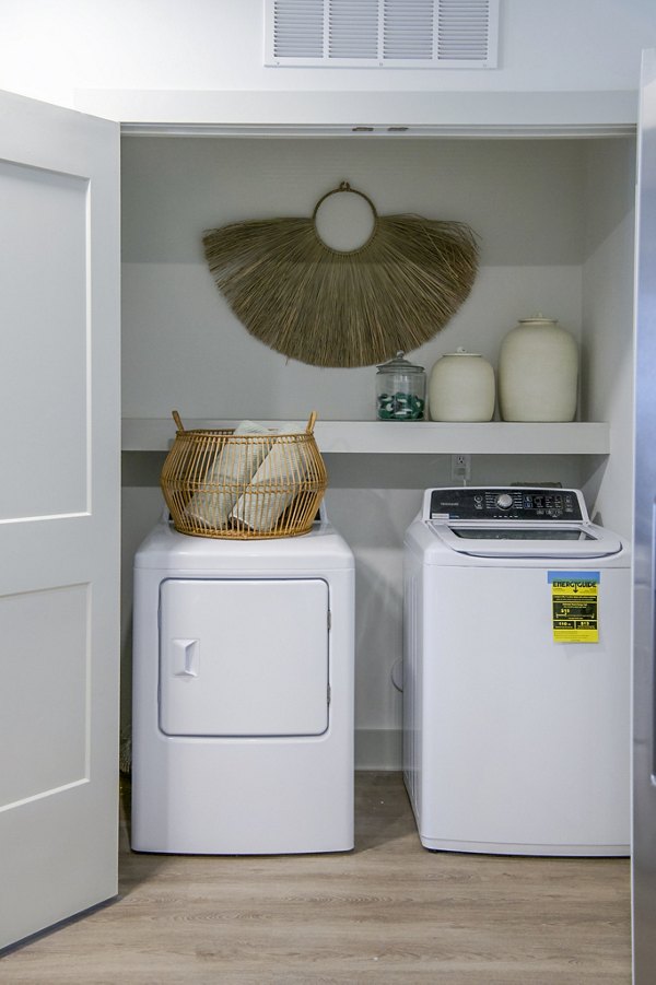 Laundry room with modern appliances at Lakehouse on Wylie Apartments