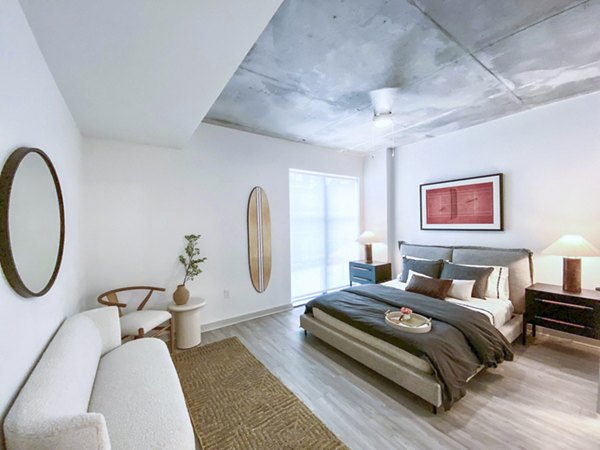 Cozy bedroom with modern decor at Atlantic on Romney Apartments