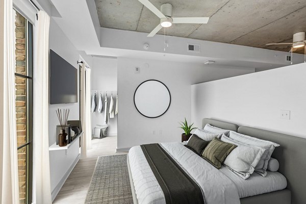Atlantic on Romney Apartments: Elegant bedroom with plush bedding and large windows