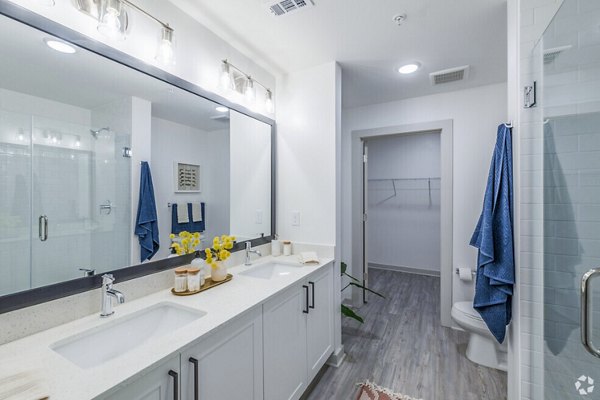 Atlantic on Romney Apartments: Modern bathroom with sleek fixtures and elegant tile design