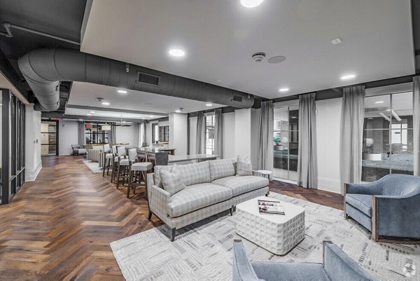 Clubhouse featuring luxury seating and modern design at Atlantic on Romney Apartments