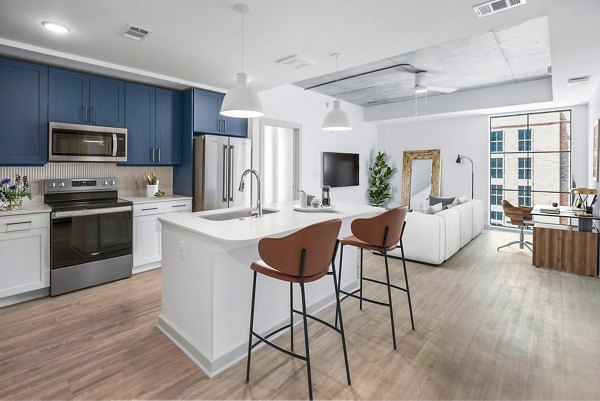 Atlantic on Romney: Modern kitchen with stainless steel appliances and granite countertops in luxury apartments