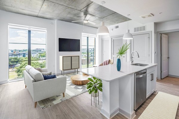Modern kitchen with sleek countertops and stainless steel appliances at Atlantic on Romney Apartments