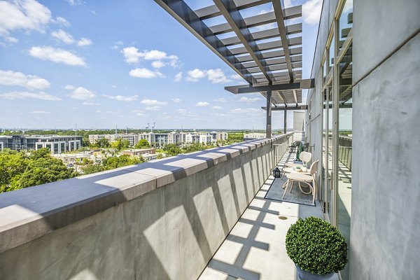 Private balcony with seating area at Atlantic on Romney Apartments, perfect for relaxation and enjoying city views