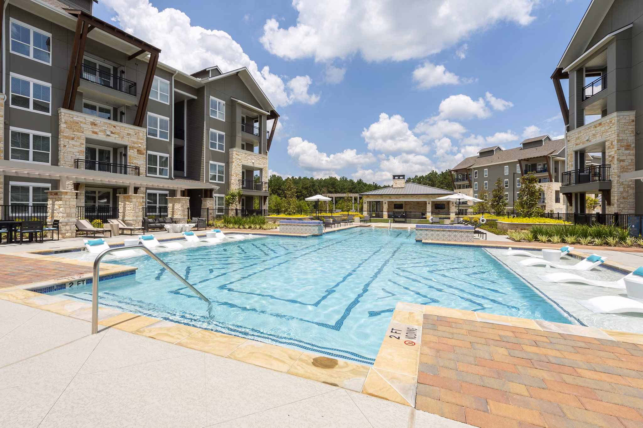 Infinity pool at Creekside Park The Grove Apartments offering luxurious relaxation for residents
