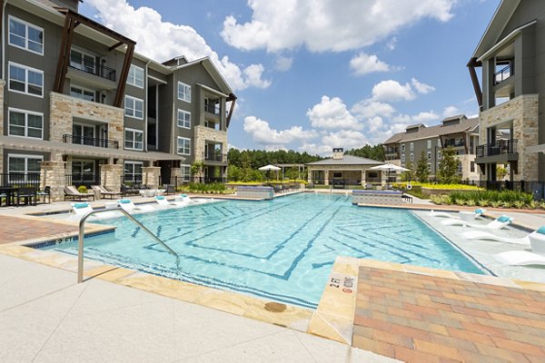 Infinity pool at Creekside Park The Grove Apartments offering luxurious relaxation for residents