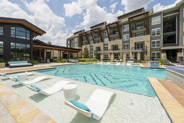 Luxurious poolside lounge area at Creekside Park The Grove Apartments for relaxation and leisure