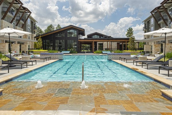 Luxury pool at Creekside Park The Grove Apartments with lush landscaping and relaxation areas