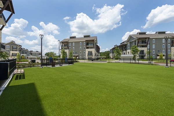 Off-leash dog park at Creekside Park The Grove Apartments, perfect for pet-friendly luxury living