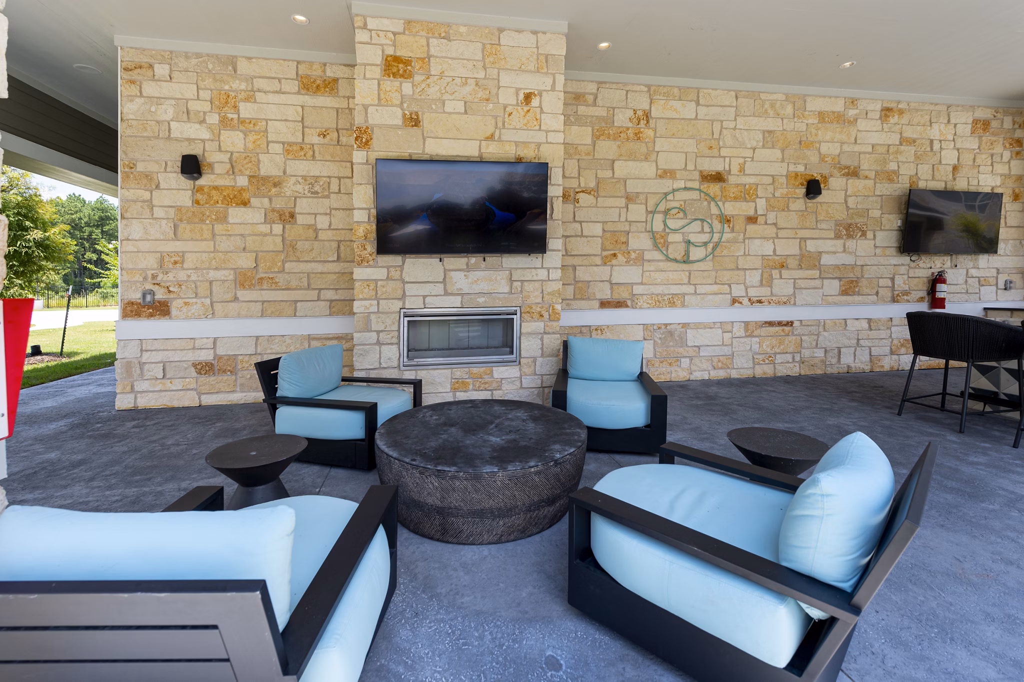 Cozy outdoor fire pit area at Creekside Park The Grove Apartments, perfect for social gatherings and relaxing evenings
