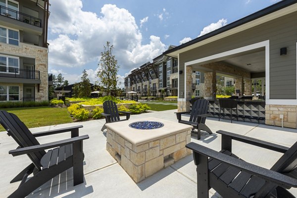 Fire pit seating area at Creekside Park The Grove Apartments, a luxurious outdoor amenity perfect for relaxation and social gatherings