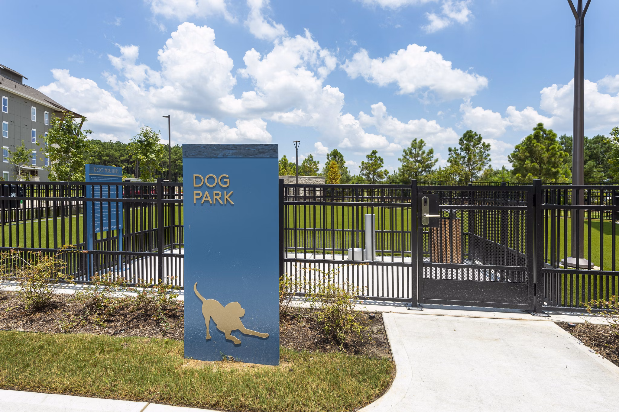 Dog park with agility equipment at Creekside Park The Grove Apartments