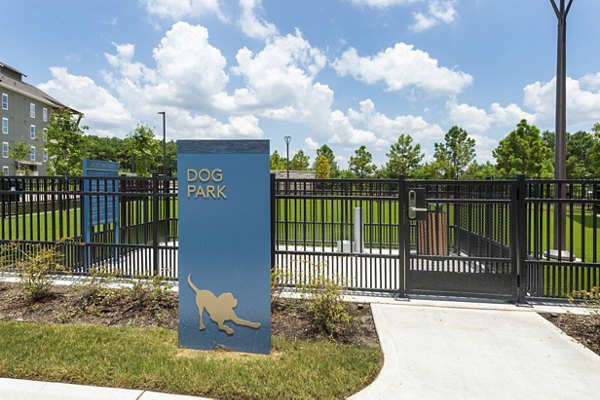 Dog park with agility equipment at Creekside Park The Grove Apartments