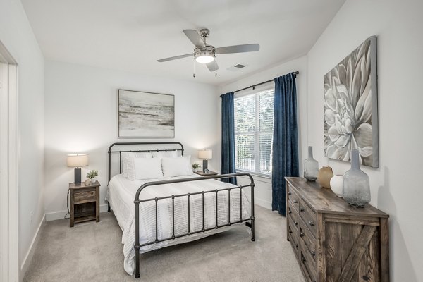 Contemporary bedroom with natural light in Creekside Park The Residences luxury apartments