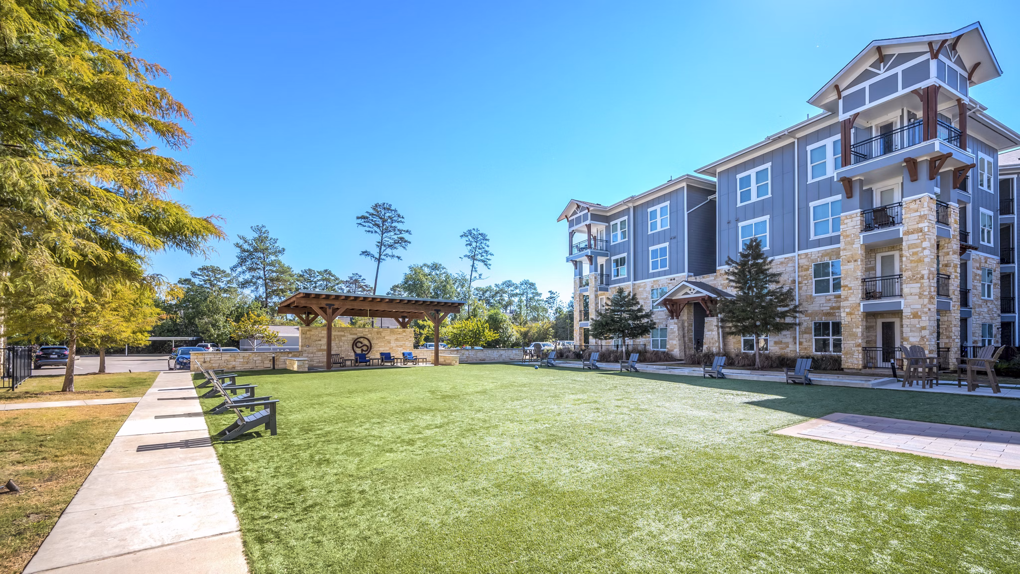 Courtyard at Creekside Park The Residences featuring lush gardens and seating areas