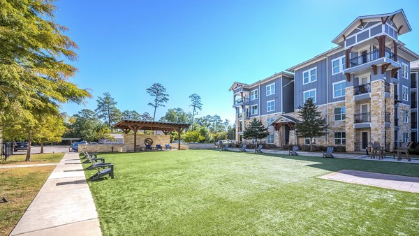 Courtyard at Creekside Park The Residences featuring lush gardens and seating areas