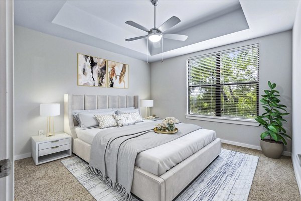 Spacious bedroom featuring modern decor at The Dylan Apartments
