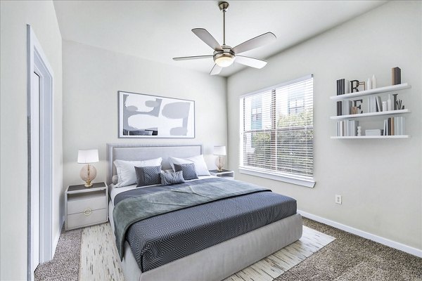 Modern bedroom with large windows and minimalist decor at The Dylan Apartments, luxury living by Greystar